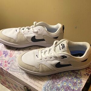 Nike women’s White and Black Sneakers